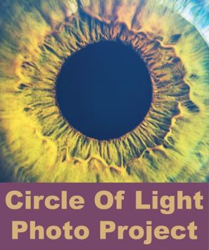 circle of light photo project up close cornea/pupil greenish blue