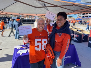 wanda cornea transplant recipient ambassador of sight rocky mountain lions eye bank volunteers at Denver Broncos game