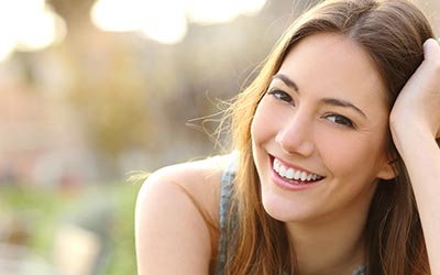 A young white woman smiling at the camera.